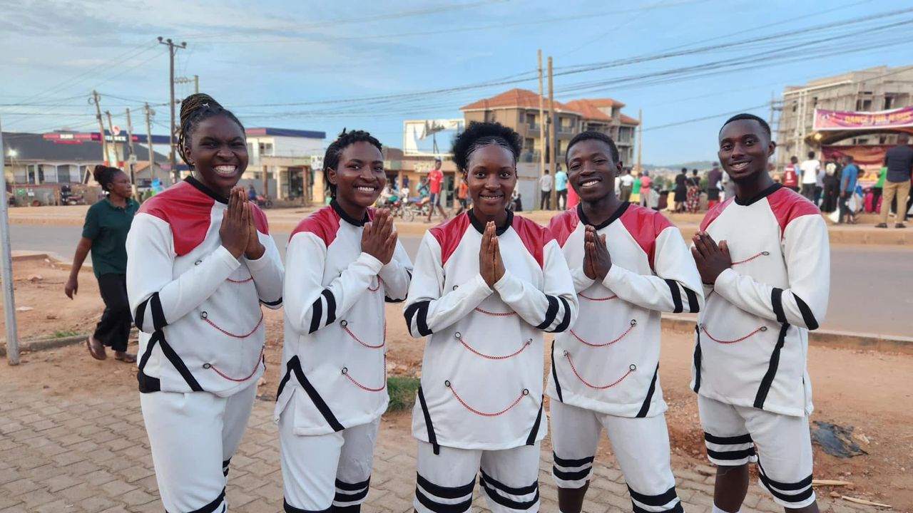 Current choir members in white ministry attire
