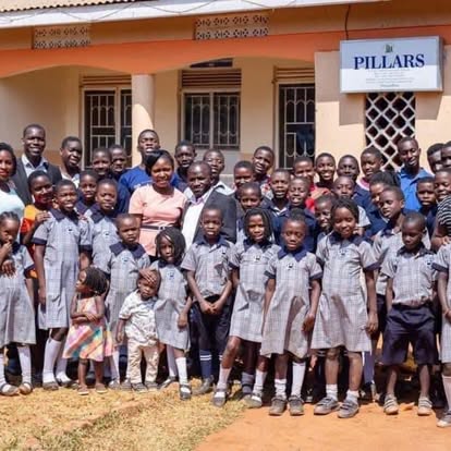 The wider school community gathered together in front of the school